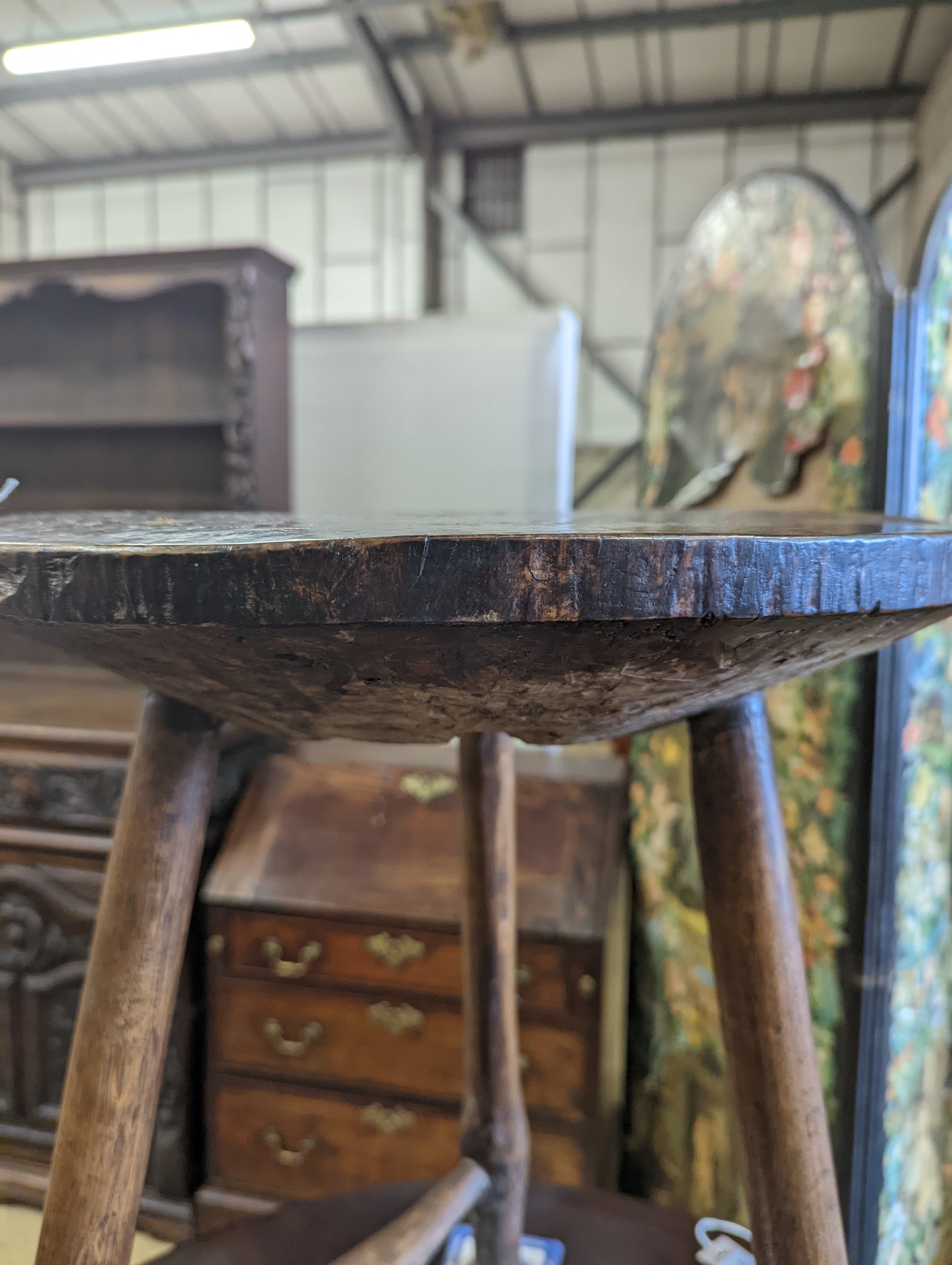 A late 18th / early 19th century circular burr elm and ash cricket table, diameter 60cm, height 62cm